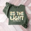 Be The Light Sweatshirt, Christmas Religious Shirt for Family, Christmas Lights Sweatshirt, Faith Shirt, Bible Verse Shirt, Gildan for Men and Women, Gift for Him or Her Be The Light Sweatshirt, Christmas Religious Shirt for Family, Christmas Lights Sweatshirt, Faith Shirt, Bible Verse Shirt, Gildan for Men and Women, Gift for Him or Her